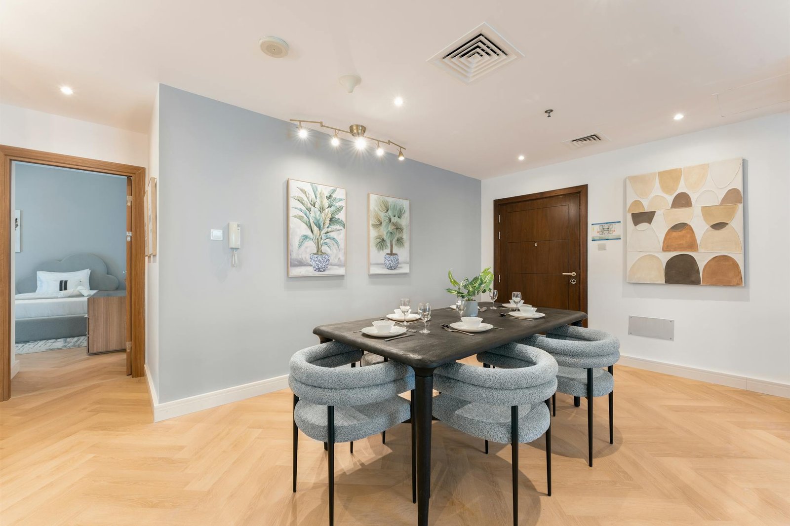 Stylish dining room featuring contemporary furniture and wall art in a bright apartment.